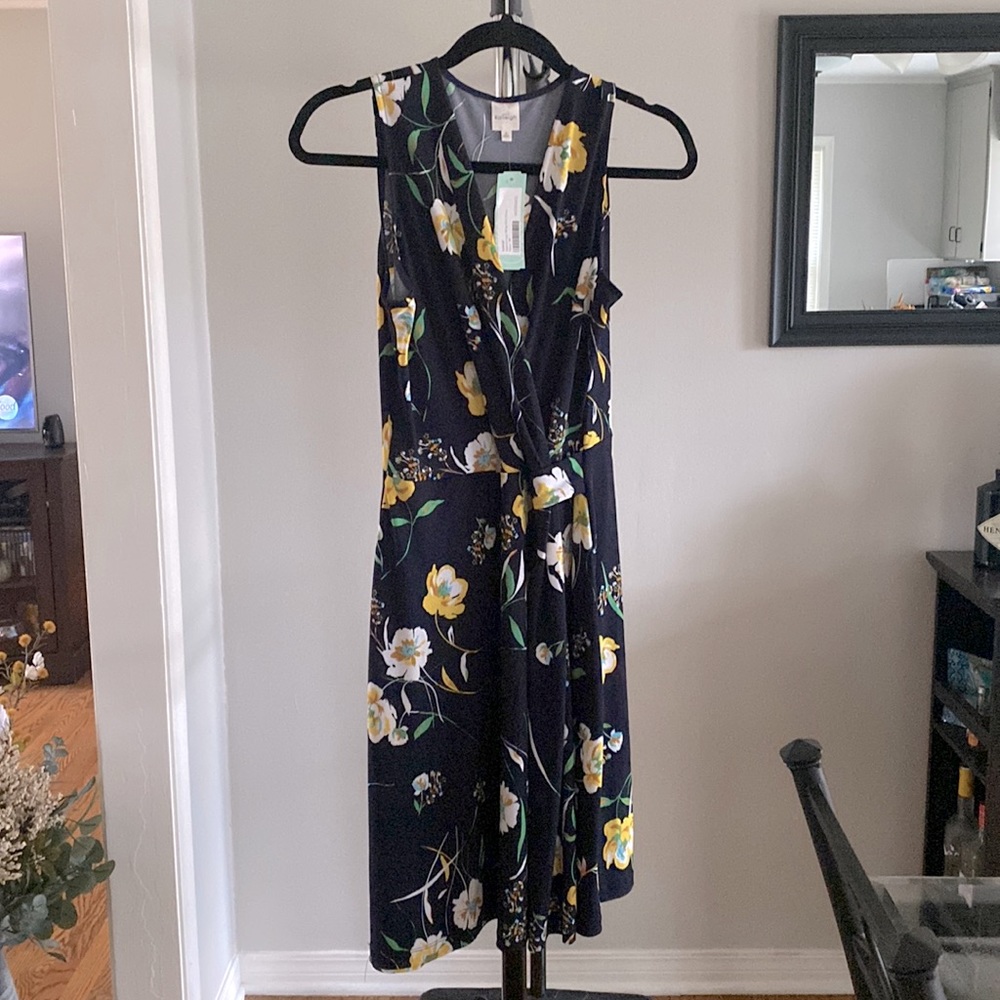 Mid length, faux wrap, navy and floral dress. Brand new with tags.